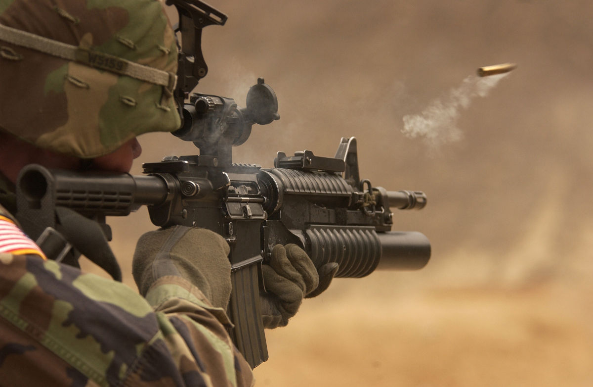 Soldier firing weapon - earplugs