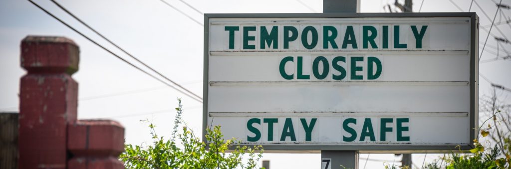 A sign saying that a business is temporarily closed due to the pandemic.