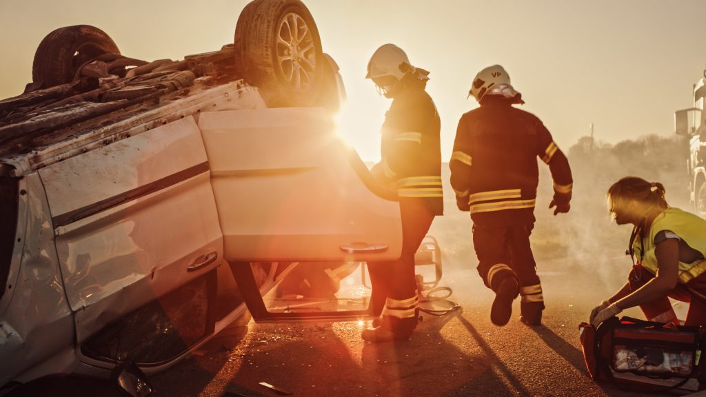 Paramedics responding to a rollover car accident