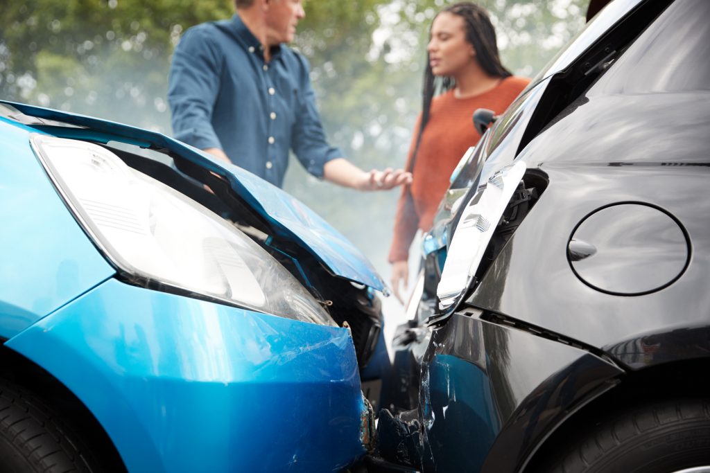 Two drivers arguing over a car accident