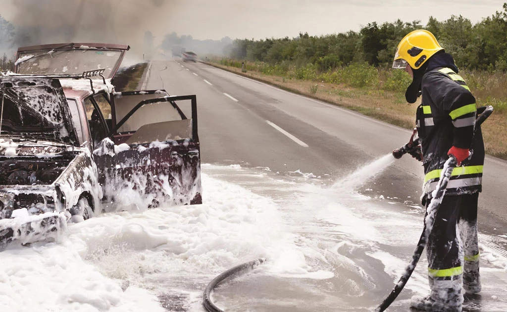 fire fighter using aqueous film forming foam (AFFF) .