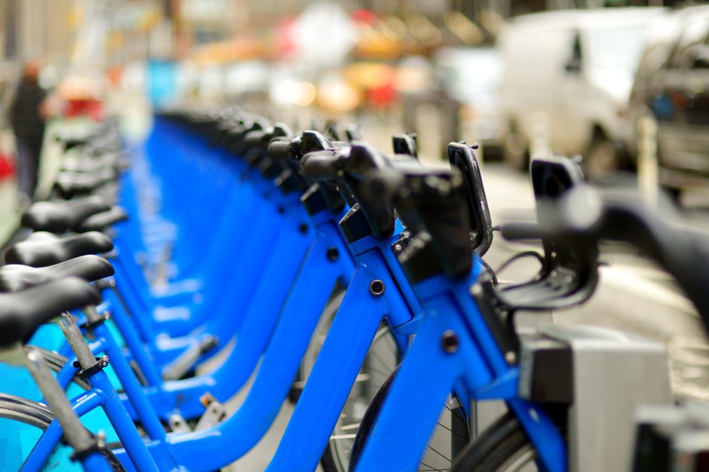 Row of blue bikes for rent in New York City